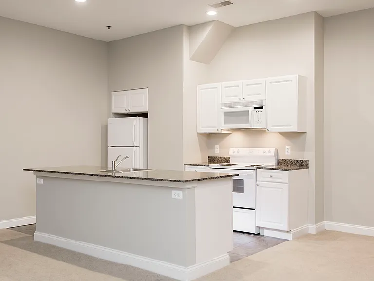 Open concept kitchen space at Victory Building Apartments