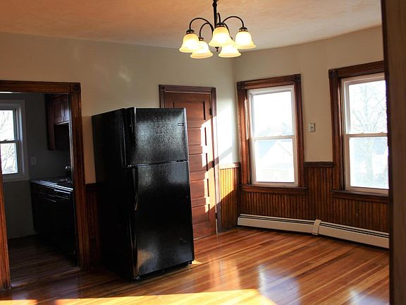 Sunny dining area with new appliances