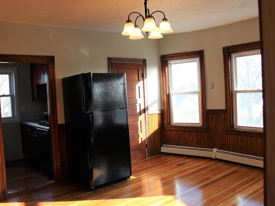 Sunny dining area with new appliances