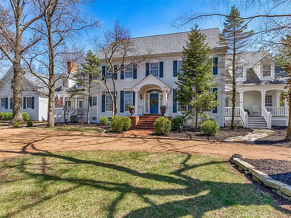 Welcome to 1440 Topping Road located on a secluded and private one acre lot in Town & Country