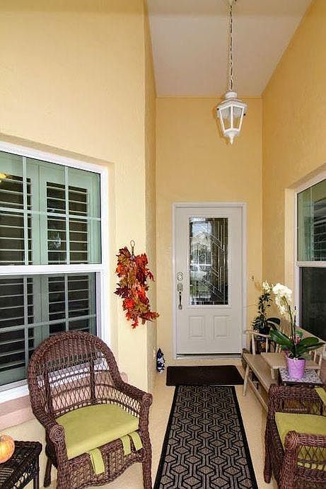Large covered and screened front lanai. For taking advantage of very social neighborhood. Great place to linger with ice tea