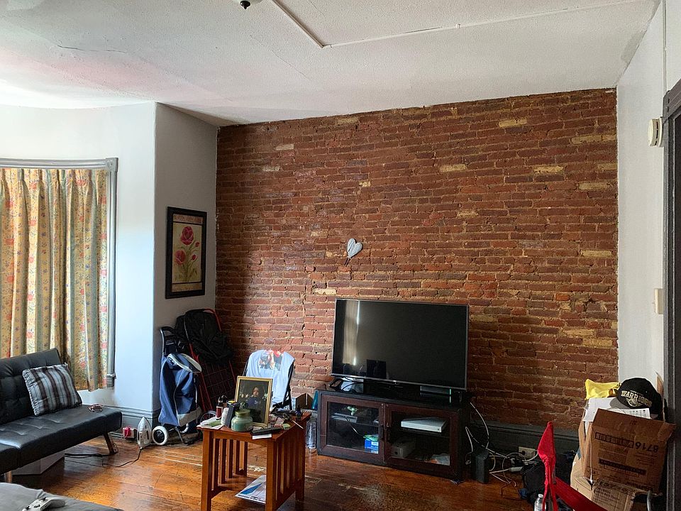 exposed brick and original hardwood floors