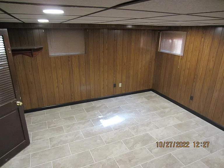 Another view of the large informal living area. The door on the left leads to the laundry area, 1/2 bath and bonus room and back door.