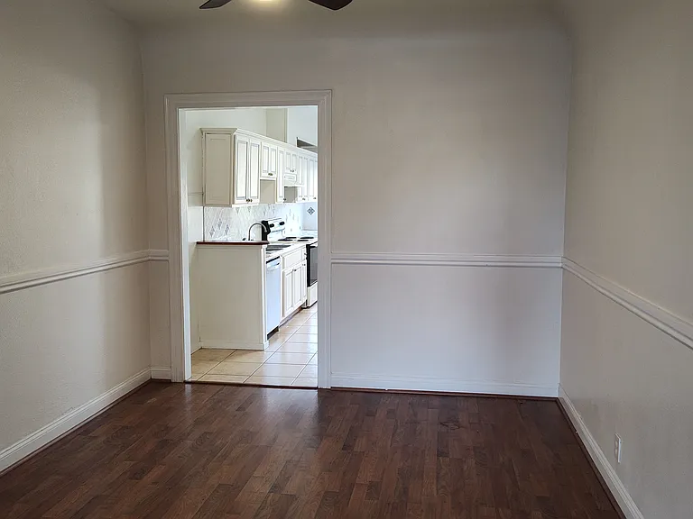 entry to dining room from living room with kitchen beyond