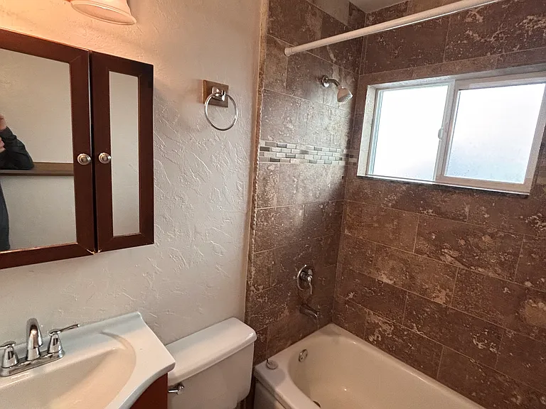 Bath has new tiled shower, fresh and clean!