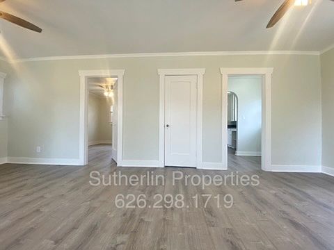 North wall of living room with center closet door