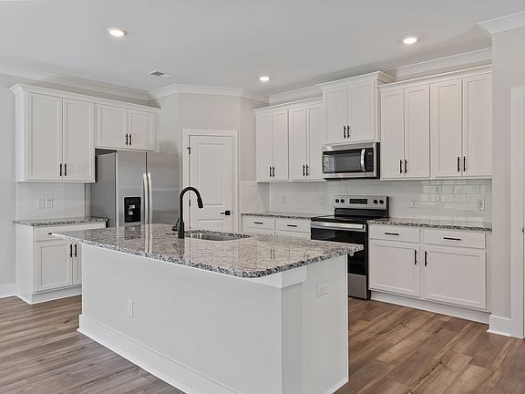 The kitchen has granite countertops