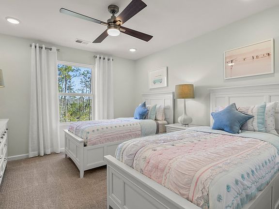 The secondary guest bedroom provides ample room for relaxation, ensuring a comfortable and rejuvenat