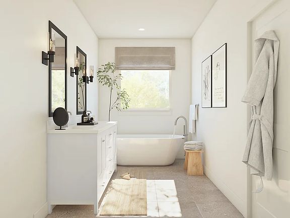 Primary bath features freestanding vanity with dual sinks