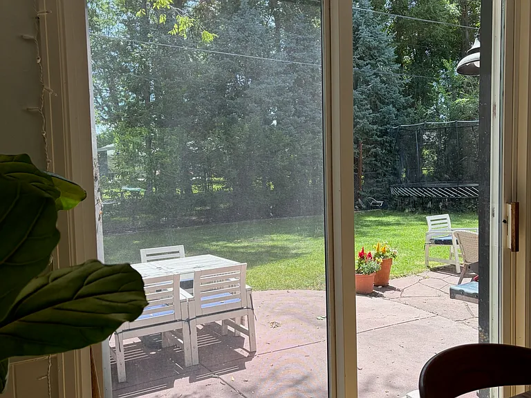 Spacious tree lined backyard