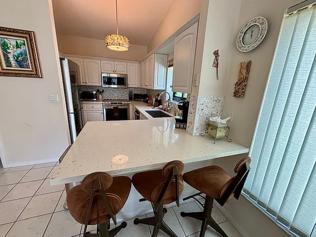 3 stools at counter, new kitchen appliances