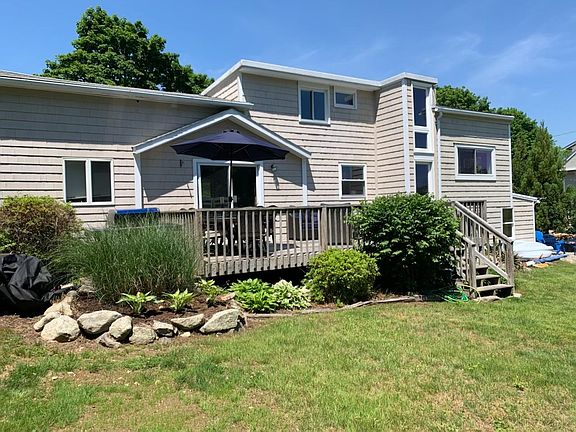 Rear of home with back deck.