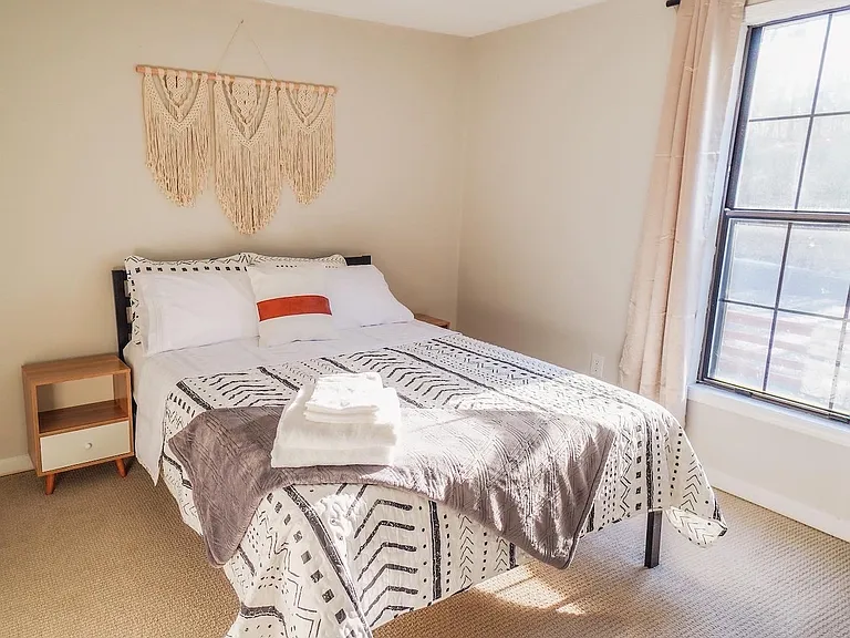 Day time photo-Private Furnished Bedroom (11x10'): Queen size bed with dresser, two nightstands, private closet, and room darkening curtains. Located on the 2nd floor along with a private full bath.