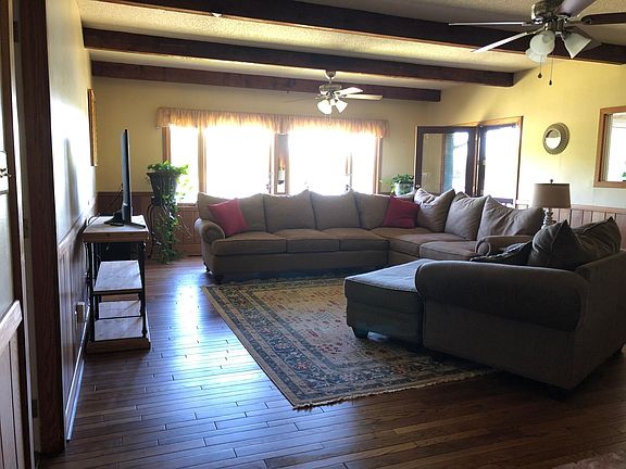 Large living room has direct access to deck.