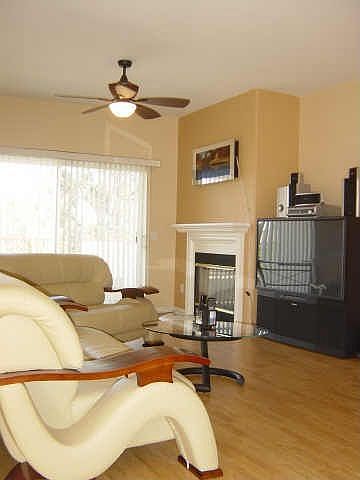 Large living room with Pergo Flooring and Fireplace