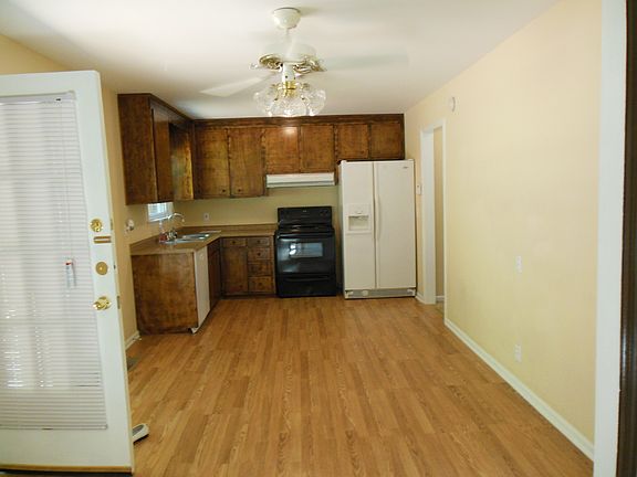 Ample eat-in kitchen with french doors to aggregate private