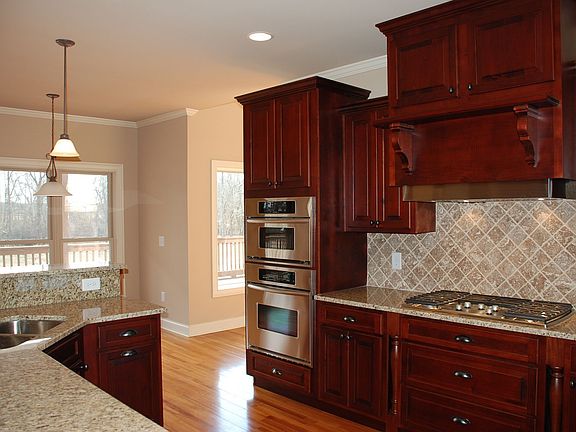 Upgrades; professional appliances; custom vent; sidexside stain. refrigerator.
