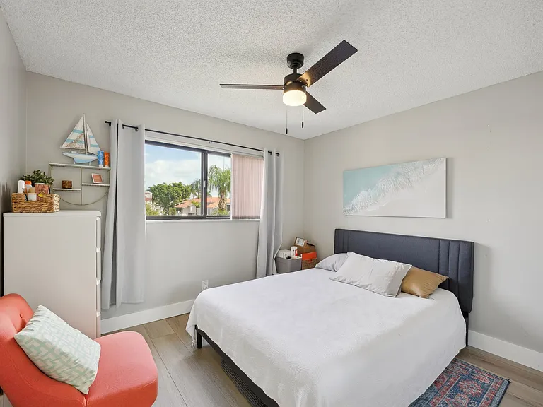 Guest bedroom includes queen bed.