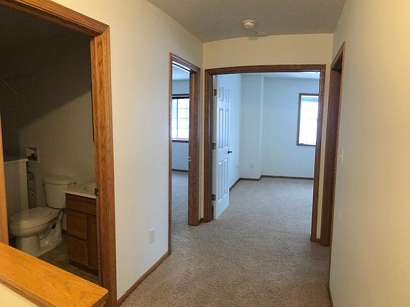 upstairs hallway with access to laundry/bathroom #2 and all three bedrooms: