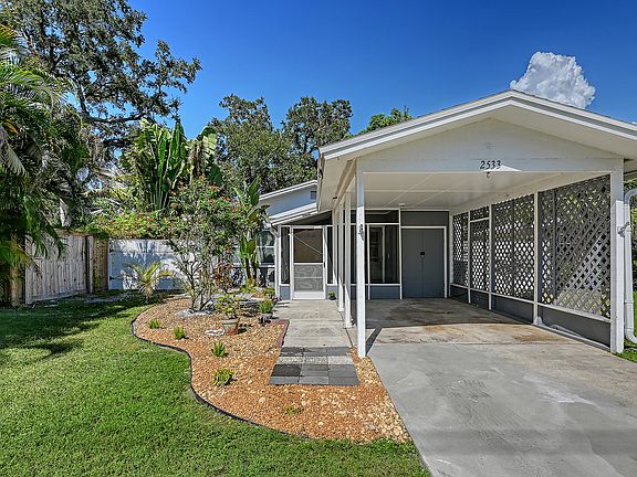 Covered parking and space for 2 more cars in driveway.