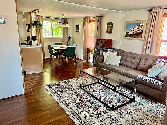 Enter into the open living room with dining area.