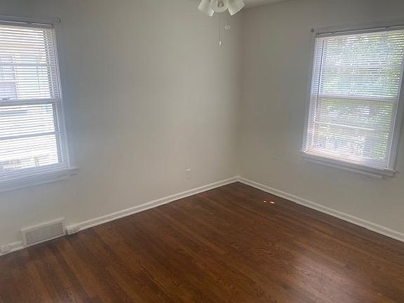 Spacious bedroom with natural light.