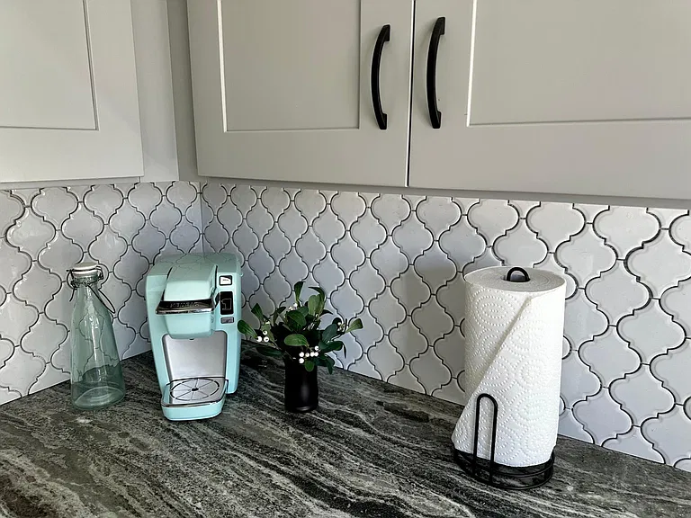 Kitchen detail with Keurig espresso coffee maker. Also supply a 12-cup drip coffee maker.