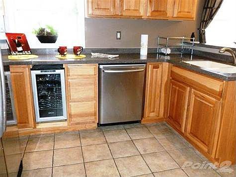 All Stainless Appliance Stay.   Dishwasher; Wine Cooler; Refrigerator; Oven/Range; Microwave; Kitchen, Breakfast Room and Breakfast Room Feature, Ceramic Tile Flooring, Better Grade Cabinets, Corian one Piece Tops. Even Has Crown Molding- had new Lighting- Also high intensity accent lighting.