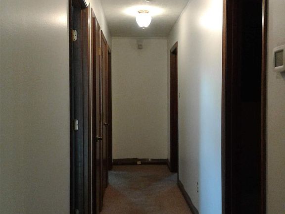 Hallway...Bedroom and two closets and master bedroom on left, door to hall bath and other bedroom on right
