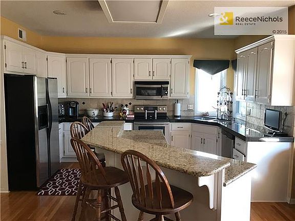 Gorgeous granite in this spacious, open, well equipped kitchen