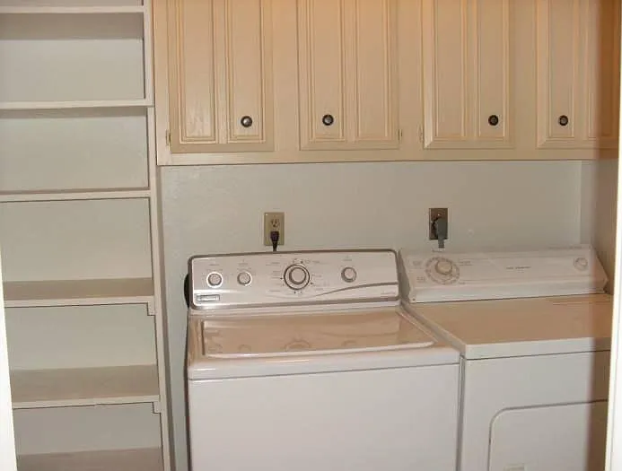 Washer and dryer with storage space inside townhome.