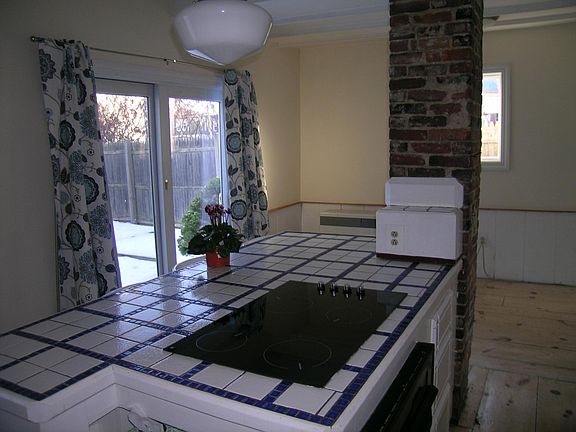 Stove top with view of back yard.