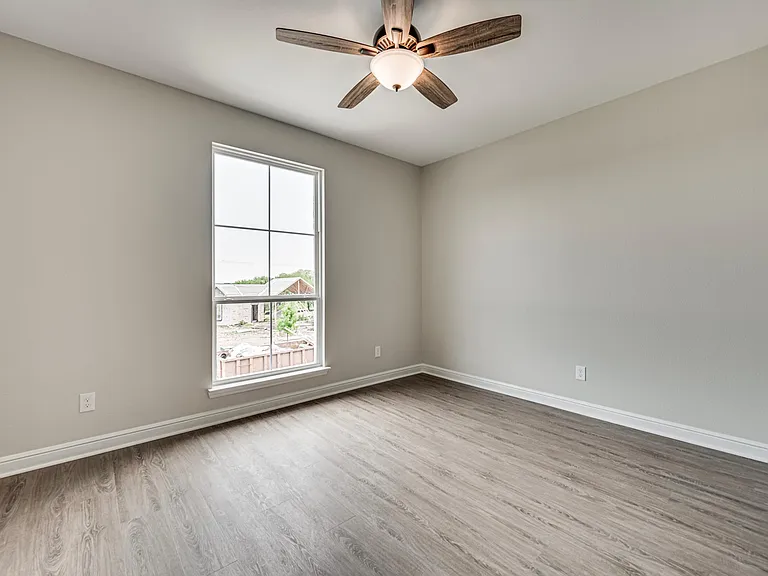 Second bedroom is above single car garage and view of pool house