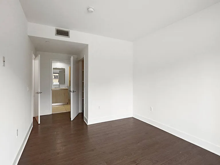 Bedroom with Walk-In Closet and Bathroom