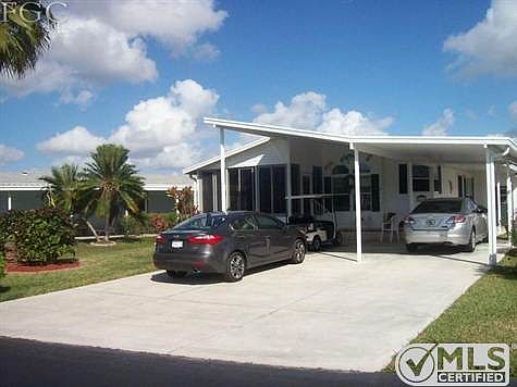 Carport/driveway can accommodate 5 vehicles.