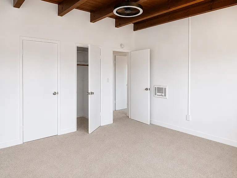bedroom 2. closet and doors to bathroom and hall