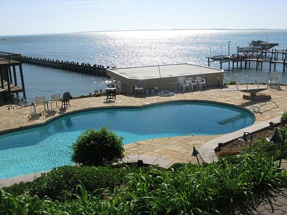 pool with diving board overlooking Bay