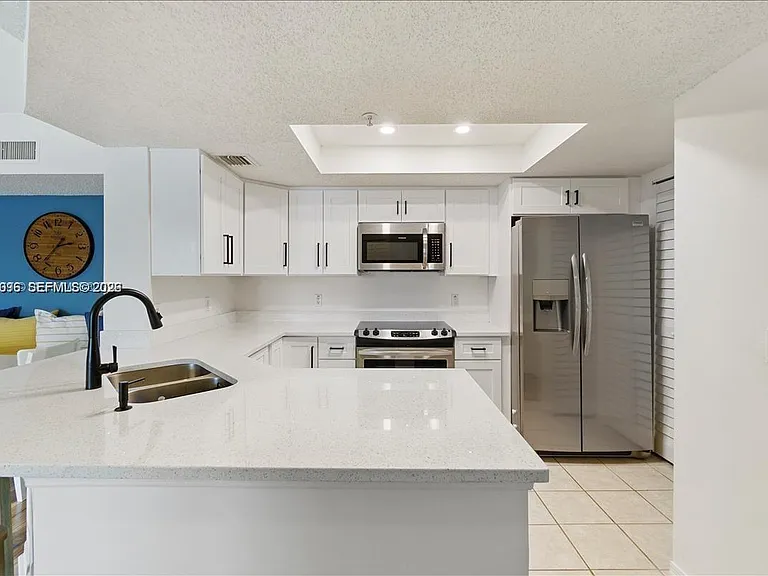 5065 Wiles Rd #308 — Photo 9