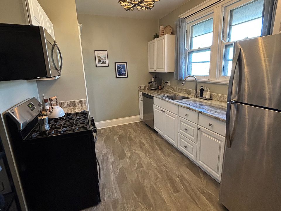 Updated cabinets, granite and stainless steel appliances are featured in this kitchen