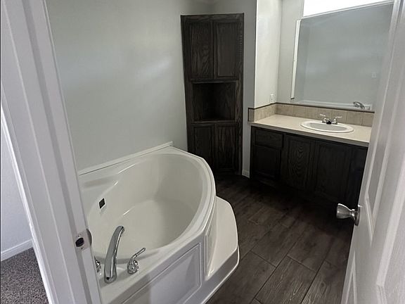 corner tub in primary bathroom