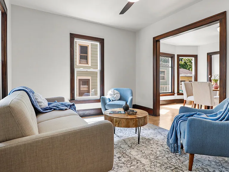 Right when you open the door, you see this cute living area opening into the dining room Lots of light!
