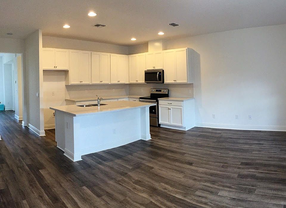 Open floor plan with two large walls for art or mounted TV.