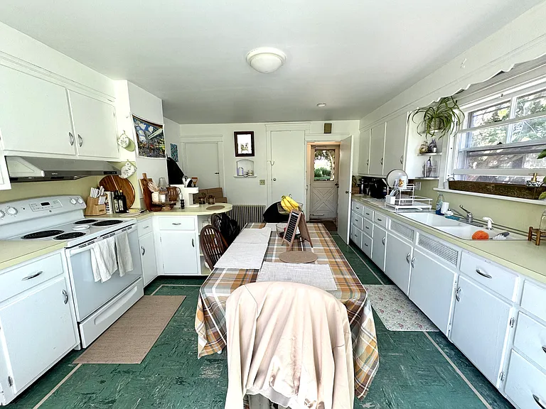 spacious eat in kithen with plenty of room for a center table or breakfast nook.