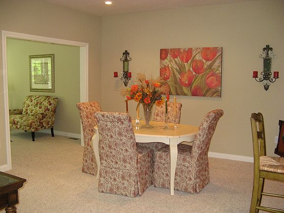 Dining room off inviting sunroom.