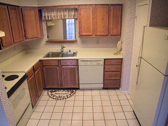 Remodeled Kitchen,wood cabinets,Tile,Mirrored sink,