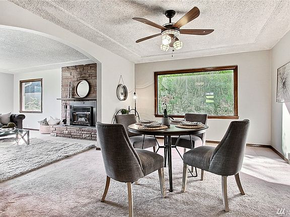 Large dining room, big window and ceiling fan