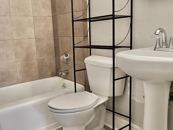 Bathroom with new toilet and flooring