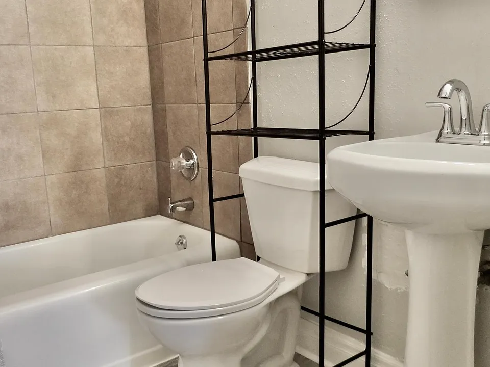 Bathroom with new toilet and flooring