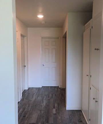 Hallway with lots of storage cabinets