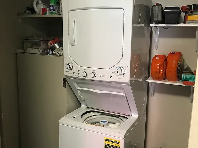 Huge walk-in pantry closet with storage space and in-unit washer and dryer